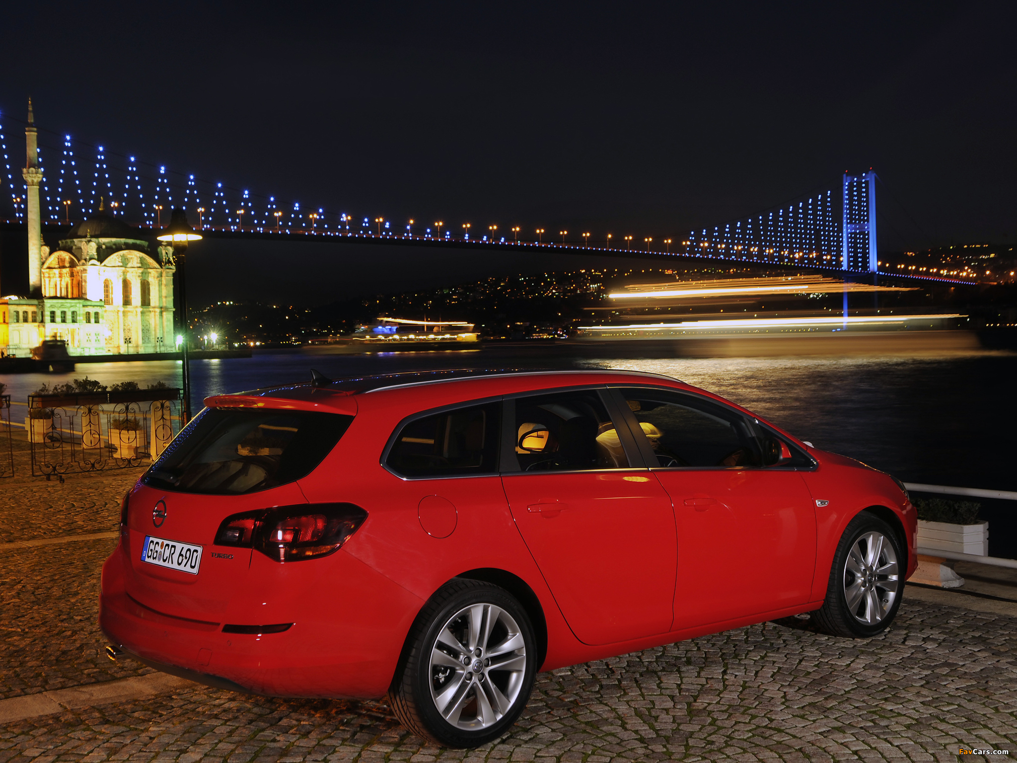 Photos of Opel Astra Sports Tourer (J) 2010–12 (2048 x 1536)
